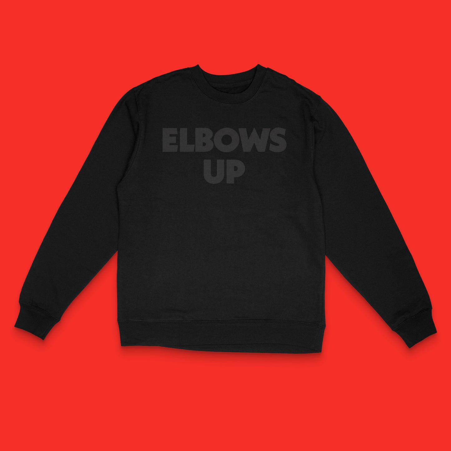 "Elbows Up" large text in matte black on black Canadian-made crewneck sweatshirt