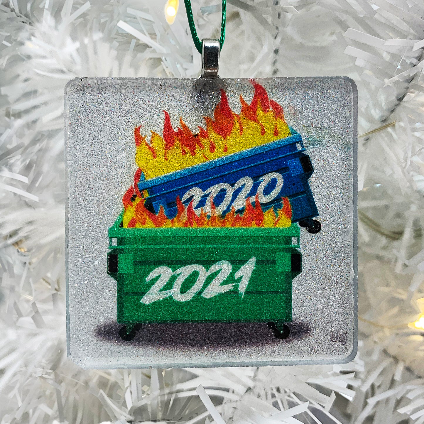 Dumpster Fires Ornament for 2021 - white pearl glitter square glass, blue and green dumpsters on fire with 2020, 2021 scrawled on fronts - 1 of 3 handmade glass and glitter ornaments in our 2021 Ornament Trio