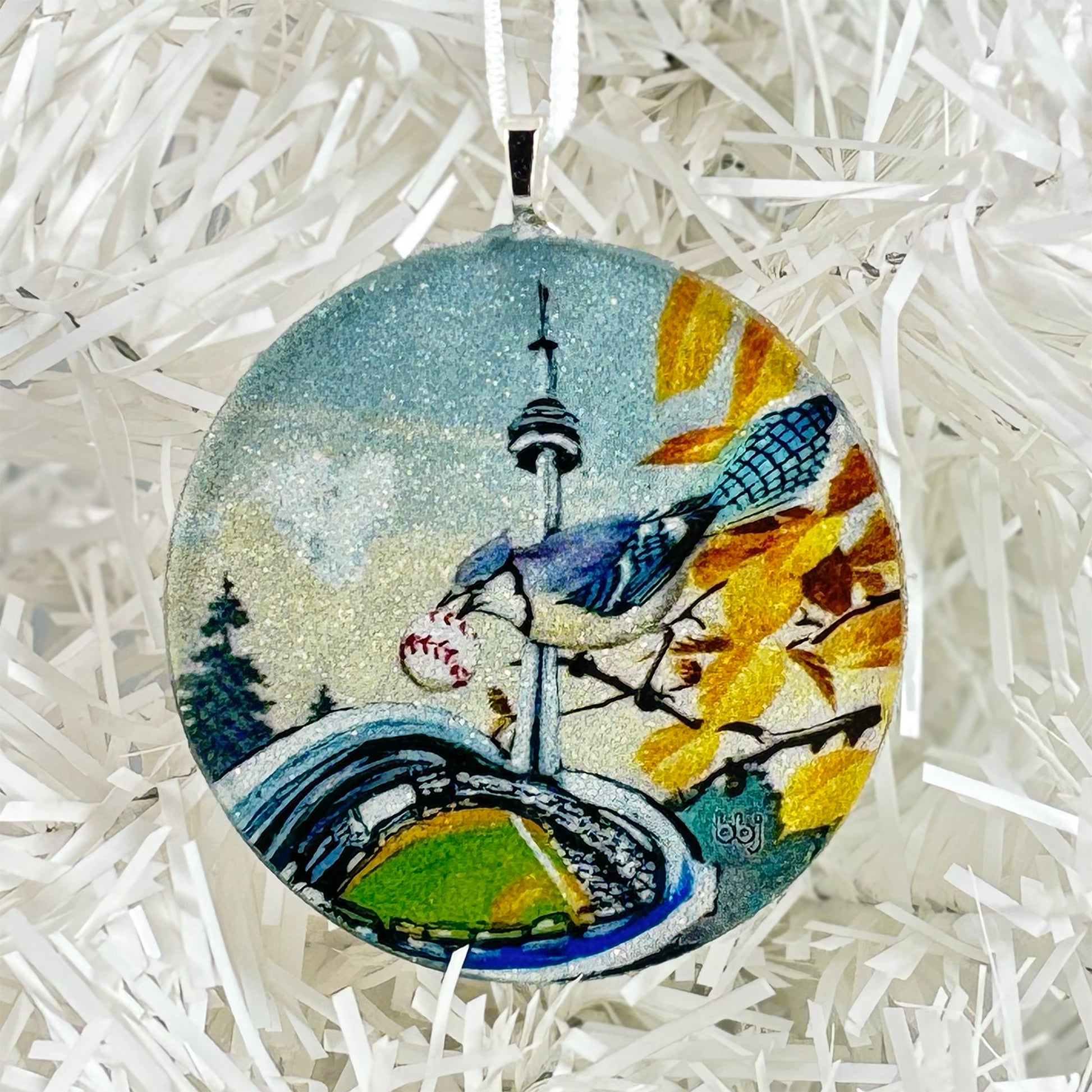 Round handmade glass ornament with a blue jay, baseball stadium, and Toronto CN Tower design 