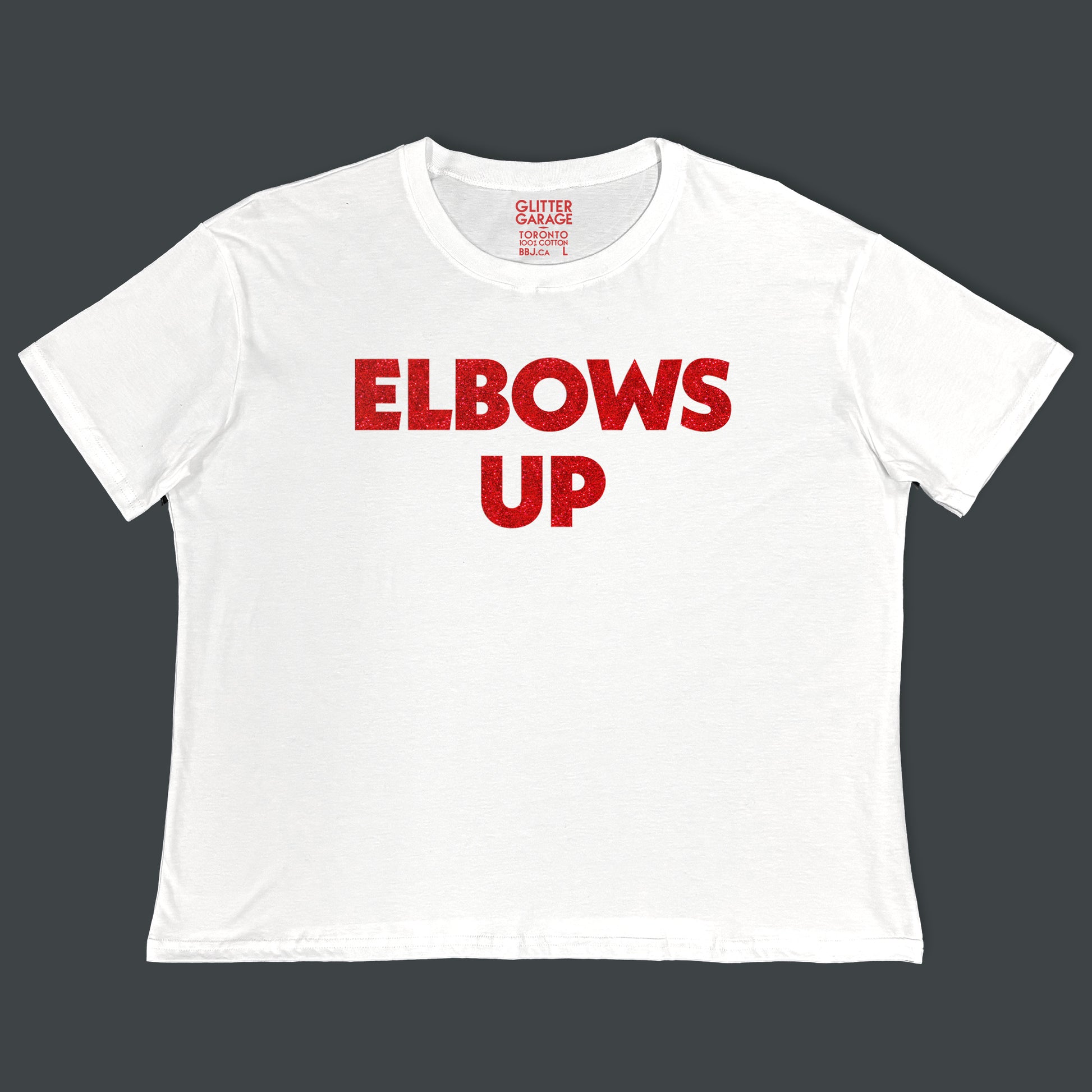 "Elbows Up" large text in red glitter on white Canadian-made boxy tee