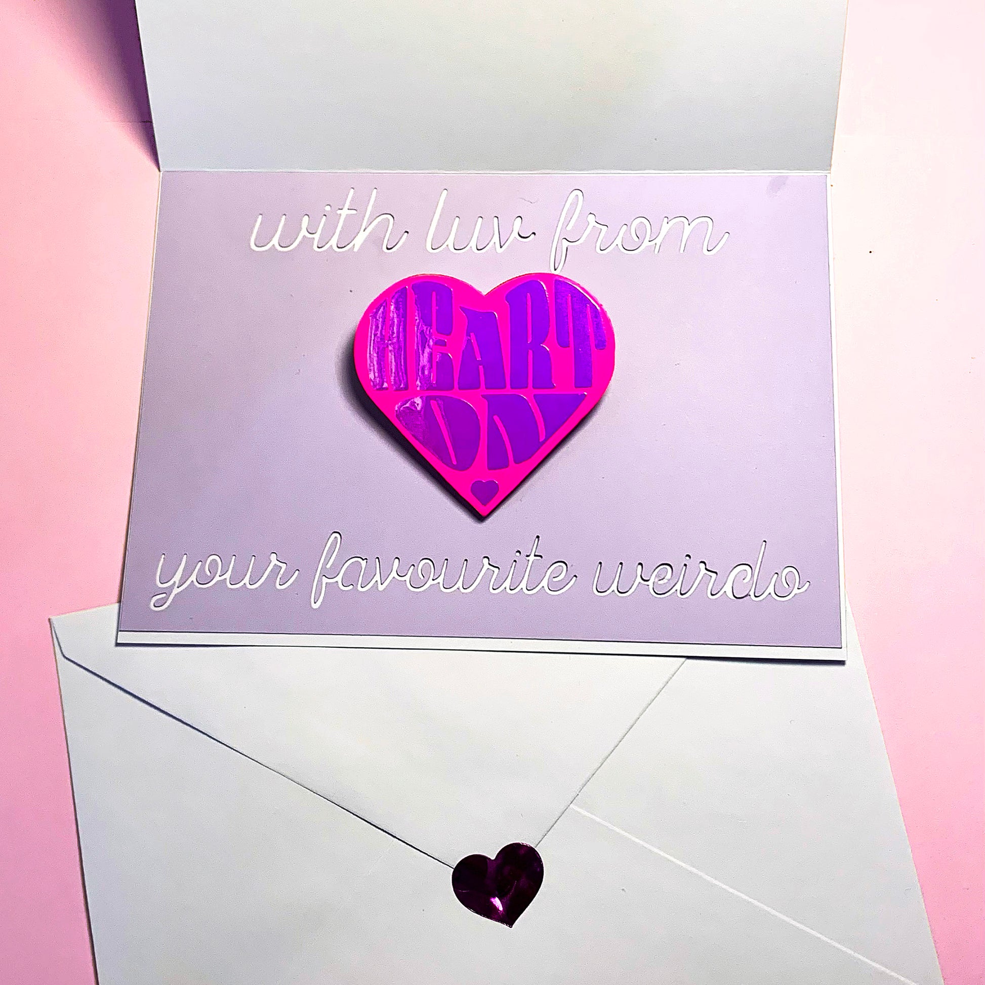 "Heart On" heart-shaped pin - holo pearl & neon pink option, packaged with personal message "with luv from your favourite weirdo" cut in lavender & white card, envelope set