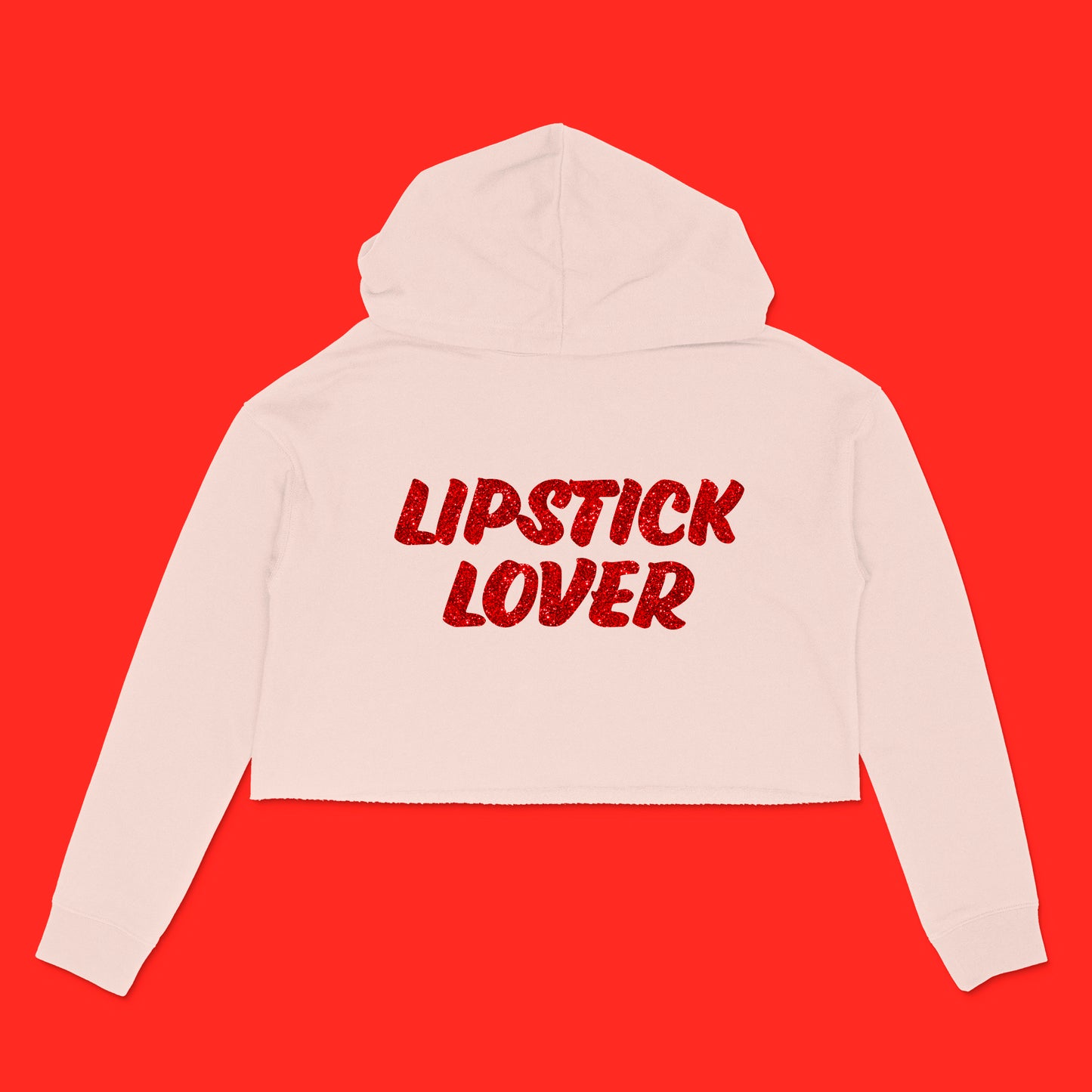 Custom text blush cropped hooded sweatshirt with "Lipstick Lover" in red glitter brush text by BBJ / Glitter Garage