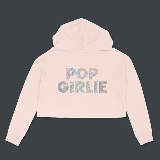 Custom text blush cropped hooded sweatshirt with "Pop Girlie" in holographic silver bold text by BBJ / Glitter Garage