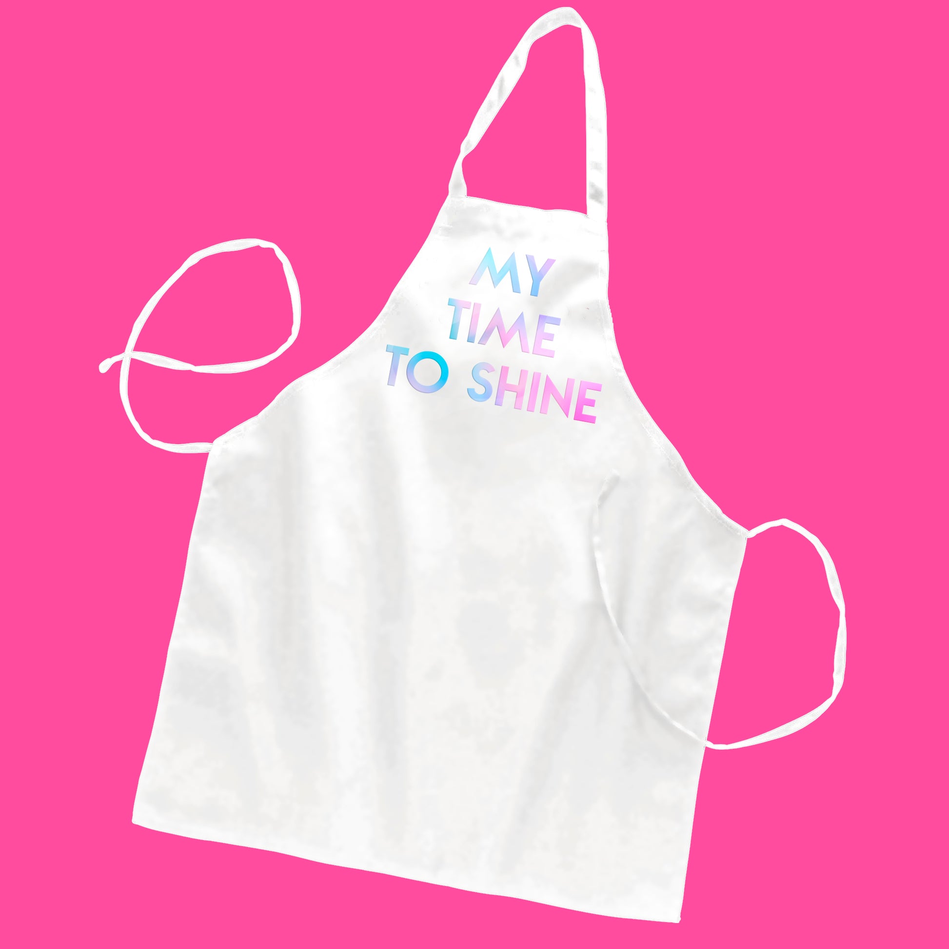 White butcher-style apron with custom text "My Time To Shine" in holographic pearl geometric text