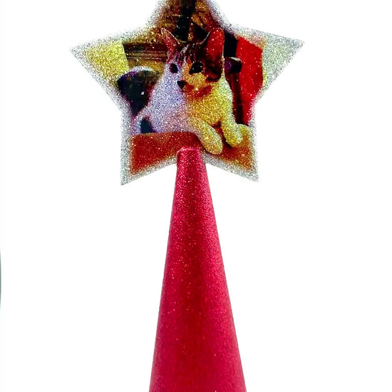 Video of double-sided custom tree topper with 2 cat images on red glitter cone