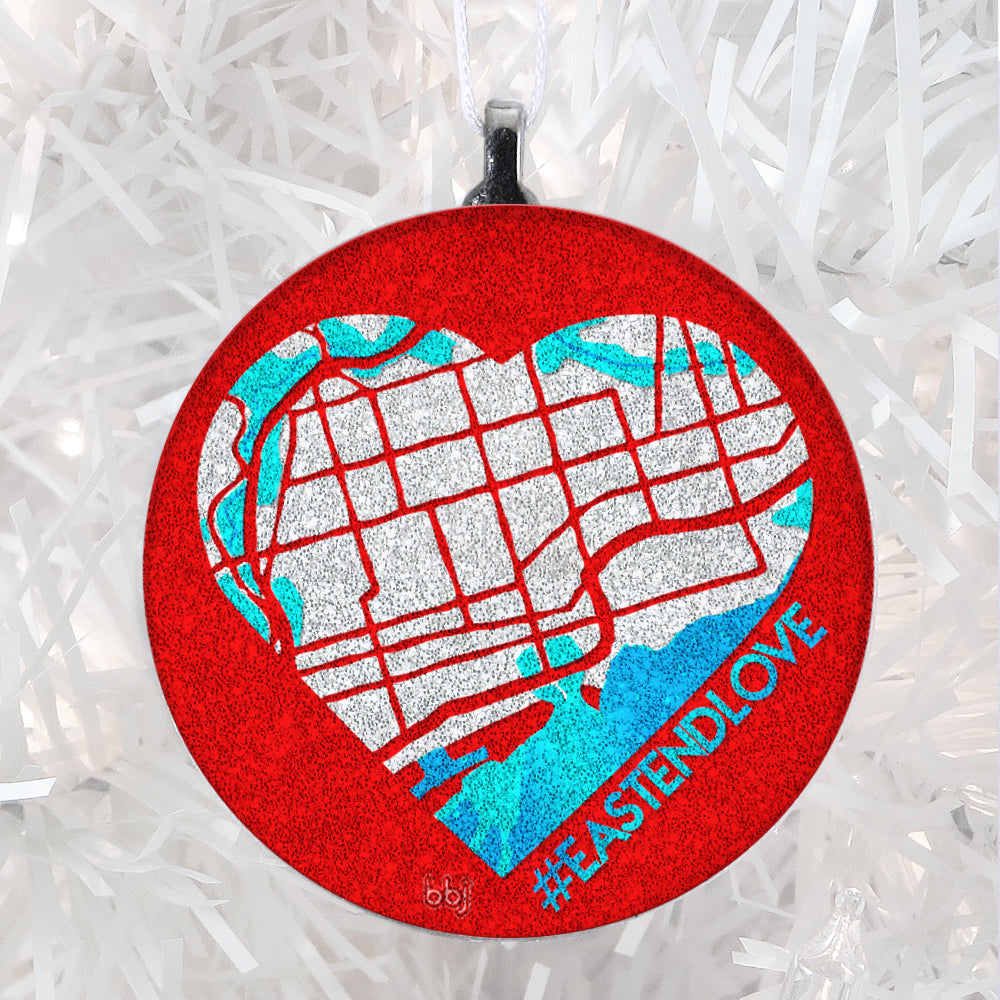 #EastEndLove handmade glass ornament, east-end-map heart is silver glitter with teal and blue accents on red background